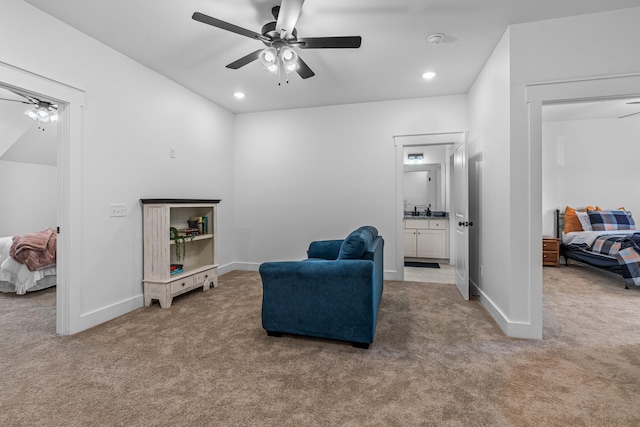 living area featuring carpet, ceiling fan, baseboards, and recessed lighting