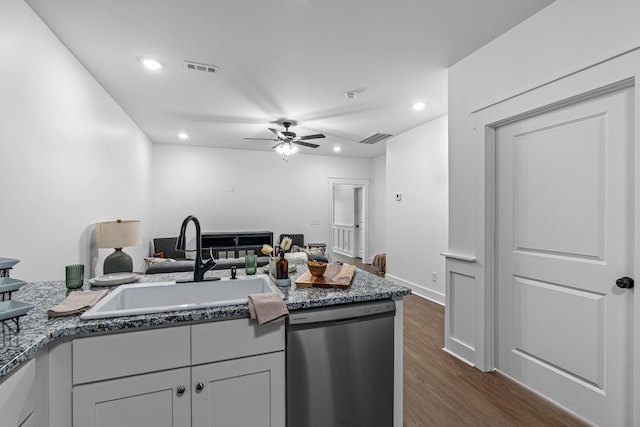 kitchen with visible vents, dark wood finished floors, dishwasher, a sink, and recessed lighting