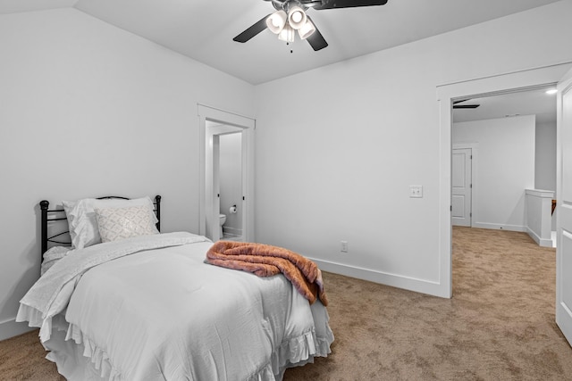 carpeted bedroom featuring lofted ceiling, ceiling fan, and baseboards