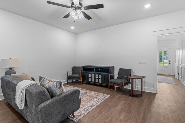 living area with recessed lighting, ceiling fan, baseboards, and wood finished floors