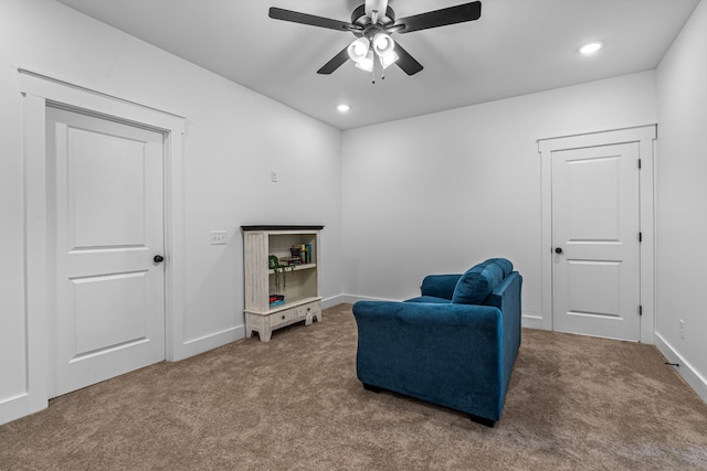 living area featuring carpet, baseboards, and recessed lighting