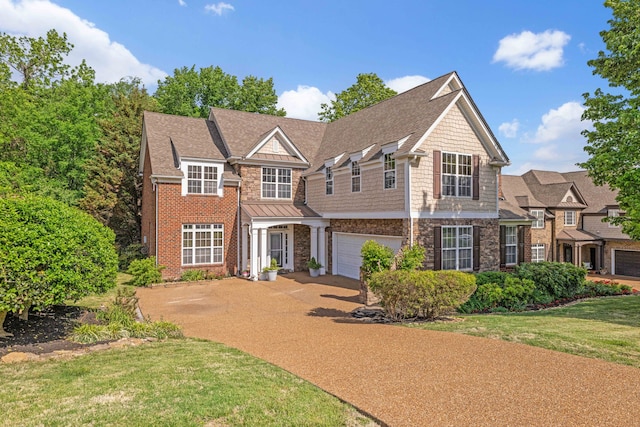 view of front of property featuring a garage and a front lawn