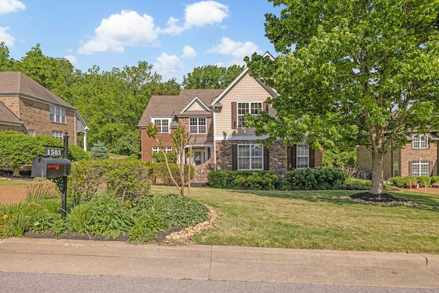 view of front of home with a front lawn