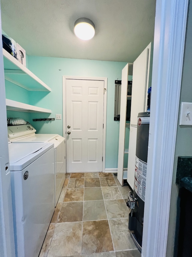 laundry area with water heater and separate washer and dryer