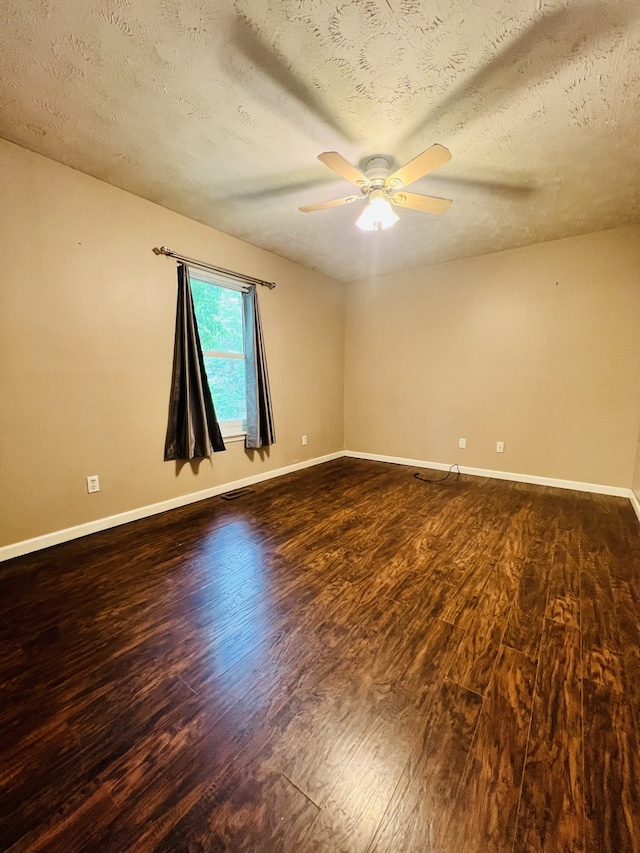 spare room featuring a textured ceiling, ceiling fan, and hardwood / wood-style flooring