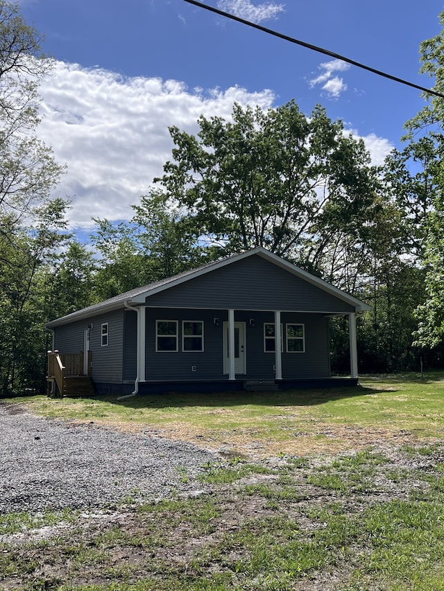 view of front of home featuring a front yard and a porch