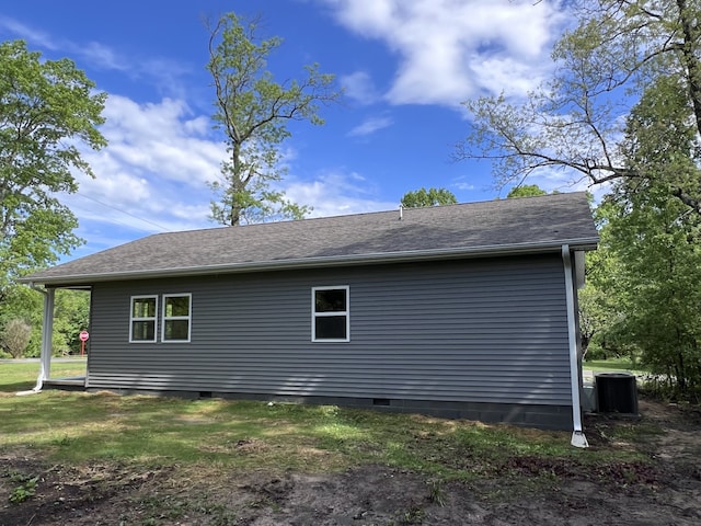 view of side of property featuring central AC