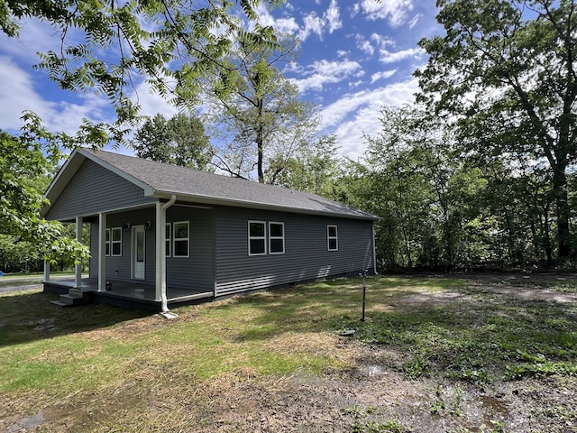 rear view of house with a lawn