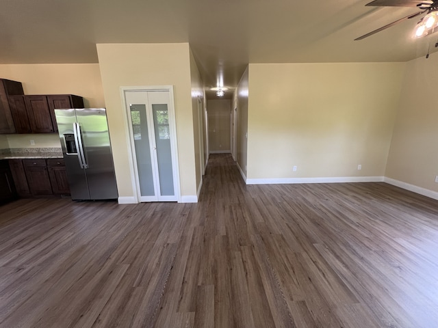 spare room featuring ceiling fan and dark hardwood / wood-style flooring