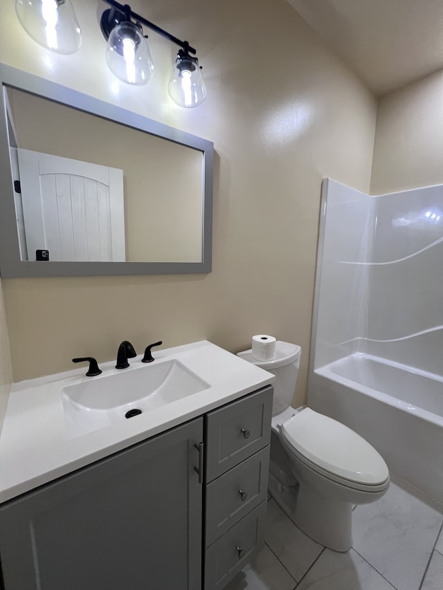 full bathroom with shower / washtub combination, tile flooring, vanity, and toilet