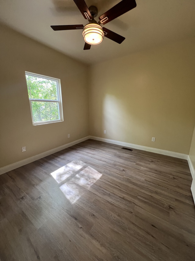 unfurnished room with wood-type flooring and ceiling fan