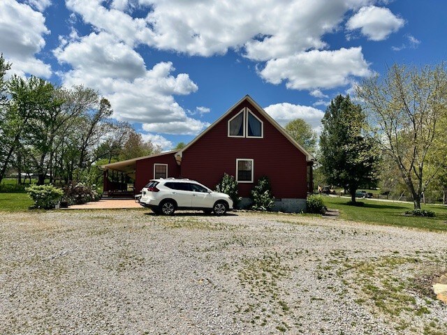 view of home's exterior featuring a carport