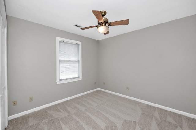 unfurnished room with ceiling fan and carpet floors