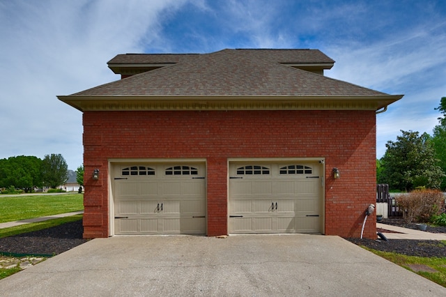 garage with a yard