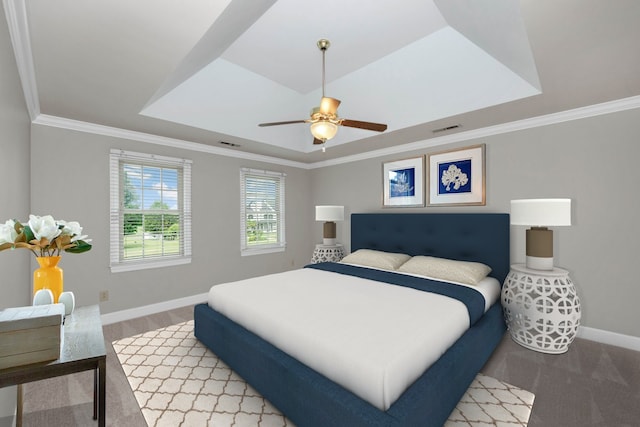 bedroom with ornamental molding, ceiling fan, and a raised ceiling