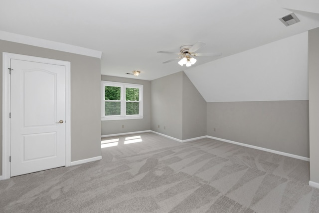 additional living space featuring vaulted ceiling, ceiling fan, and carpet flooring