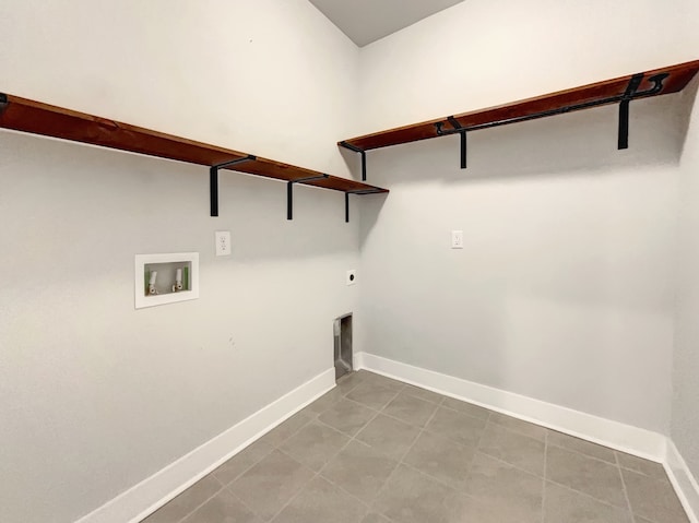 laundry area featuring tile flooring, hookup for a washing machine, and hookup for an electric dryer