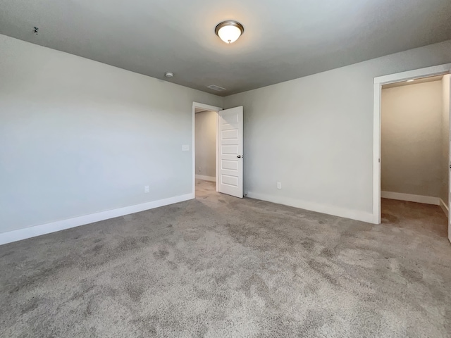 unfurnished room featuring carpet floors