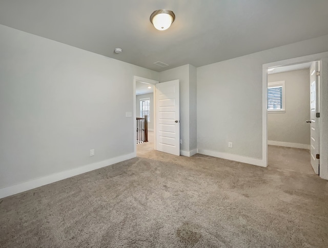 unfurnished bedroom with carpet flooring