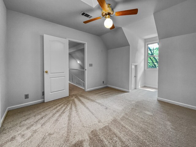 bonus room with ceiling fan, vaulted ceiling, and carpet