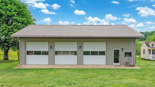 garage featuring a yard