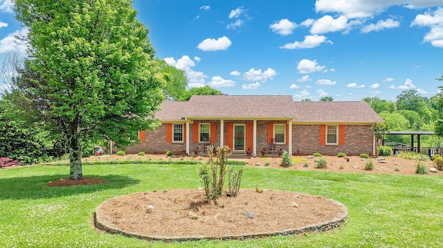 ranch-style home with a front lawn