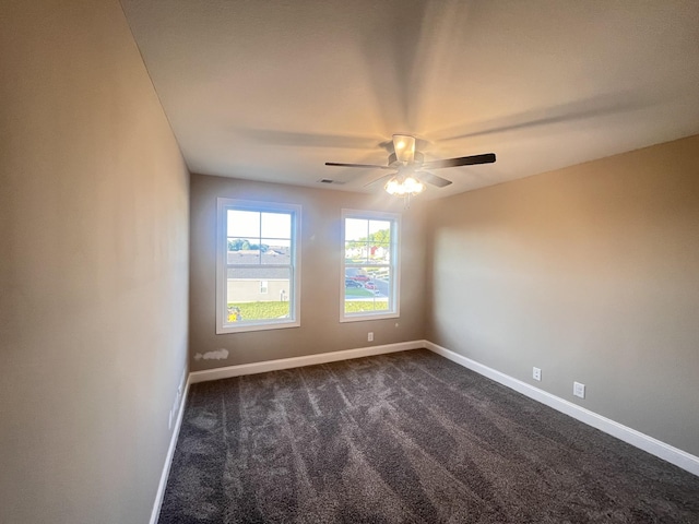 carpeted empty room featuring ceiling fan