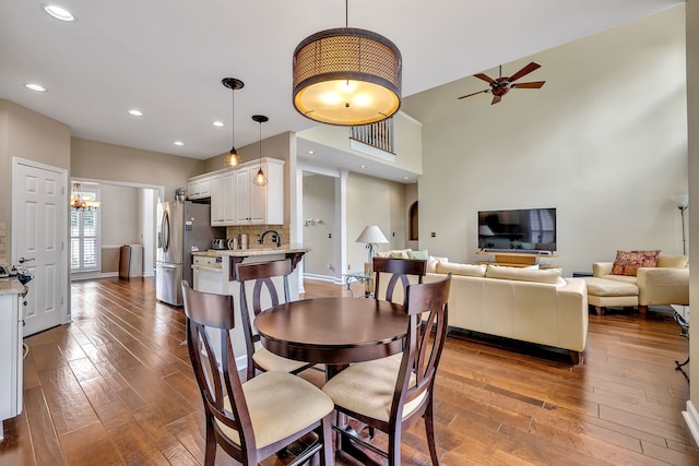 808 Seven Points Cv, Hermitage, TN 37076 - dining room featuring a towering ceiling, ceiling fan, and hardwood / wood-style floors