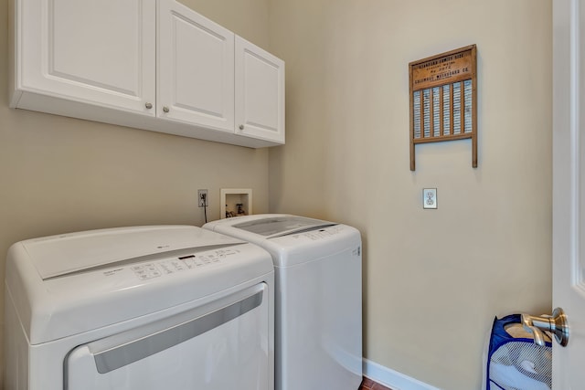 808 Seven Points Cv, Hermitage, TN 37076 - clothes washing area with hookup for a washing machine, washing machine and clothes dryer, and cabinets