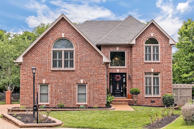 view of front property featuring a front yard