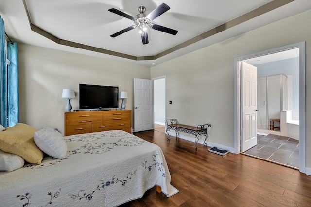 808 Seven Points Cv, Hermitage, TN 37076 - bedroom with ceiling fan, a tray ceiling, connected bathroom, and dark wood-type flooring