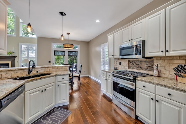 808 Seven Points Cv, Hermitage, TN 37076 - kitchen with dark hardwood / wood-style floors, hanging light fixtures, sink, white cabinets, and appliances with stainless steel finishes
