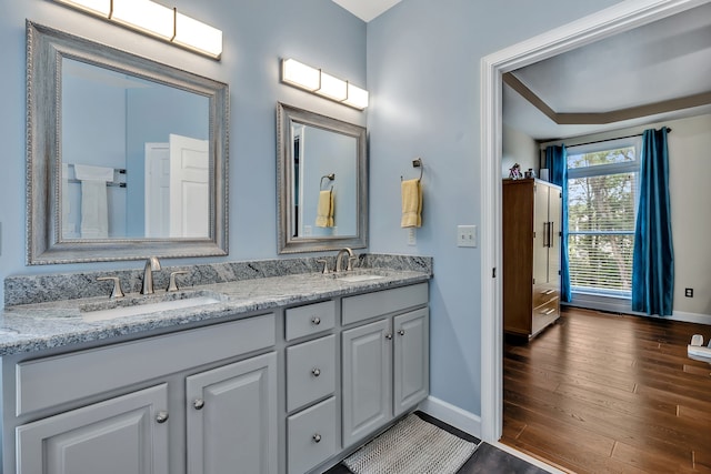 808 Seven Points Cv, Hermitage, TN 37076 - bathroom with hardwood / wood-style floors, dual vanity, and a tray ceiling