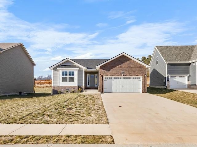 view of front facade with a garage and a front lawn