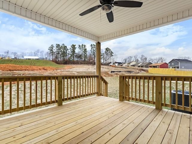 wooden terrace featuring ceiling fan