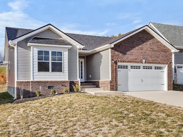 view of front of home with a garage and a front lawn