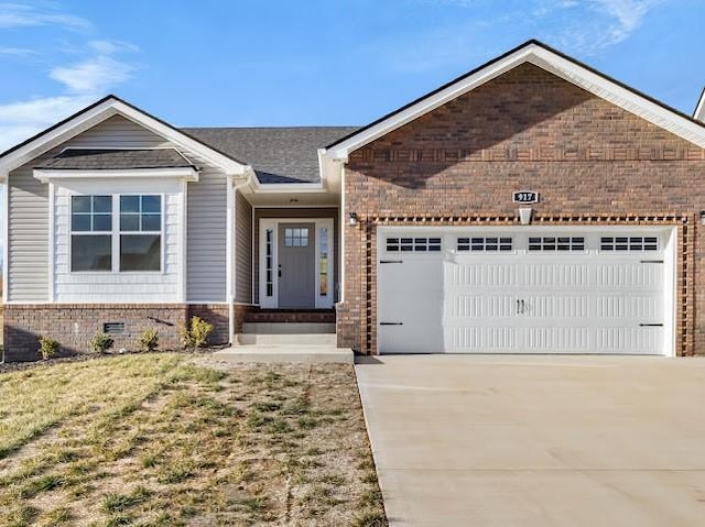 view of front of house featuring a garage and a front lawn