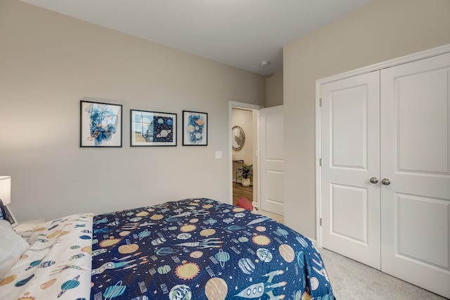 carpeted bedroom with a closet