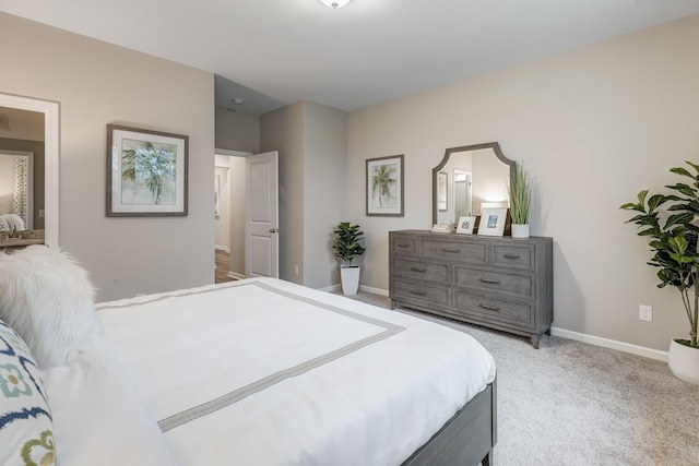 bedroom featuring light colored carpet