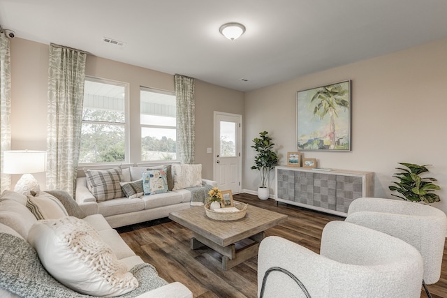 living room featuring radiator heating unit and dark hardwood / wood-style floors