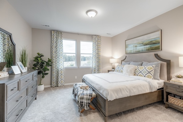 bedroom with light colored carpet