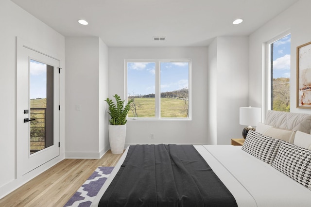 1016 W Trinity Ln Unit 1, Nashville, TN 37218 - bedroom with light wood-type flooring, recessed lighting, and access to outside