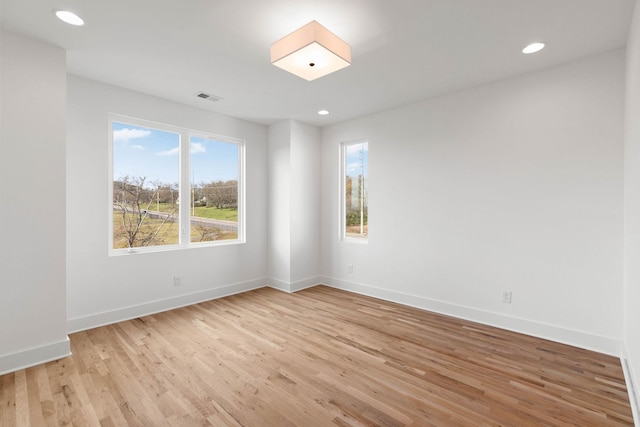 spare room with light hardwood / wood-style floors