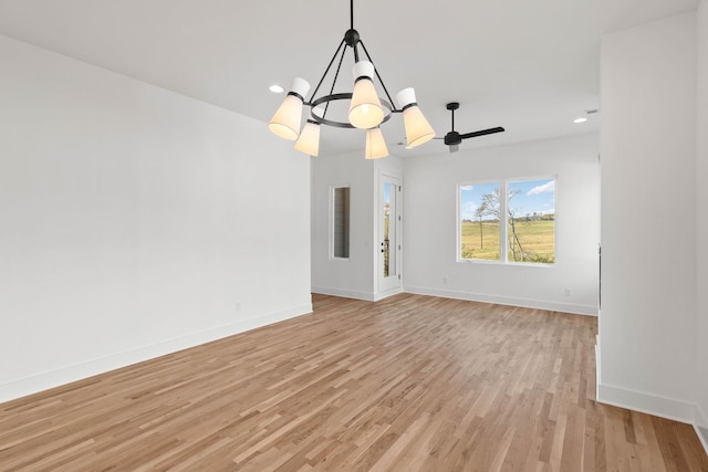 interior space featuring light hardwood / wood-style floors and an inviting chandelier