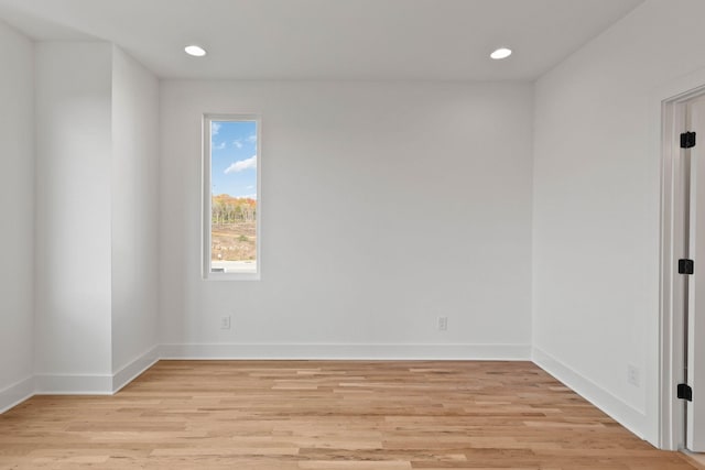 spare room with light wood-type flooring