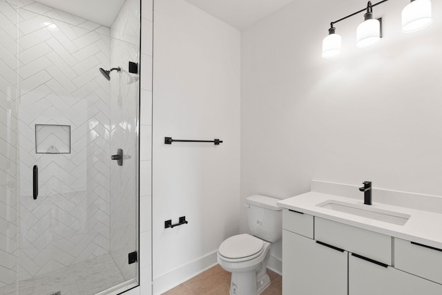 bathroom with walk in shower, tile patterned flooring, vanity, and toilet