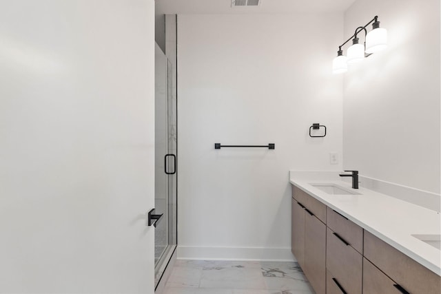1016 W Trinity Ln Unit 1, Nashville, TN 37218 - full bathroom featuring marble look tile flooring, double vanity, and a shower stall