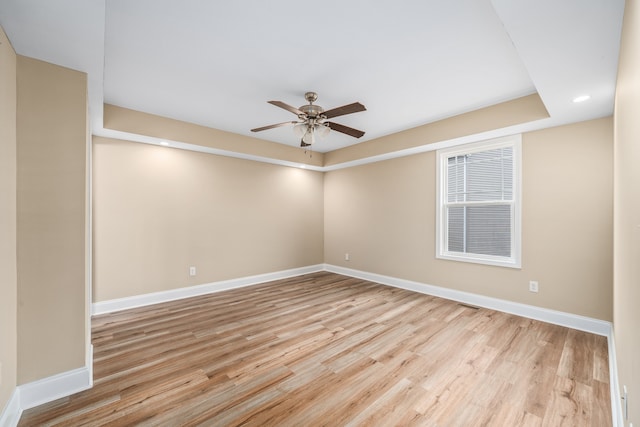 unfurnished room with light hardwood / wood-style floors and ceiling fan