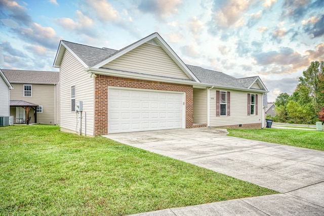 view of front of property featuring a front yard, a garage, and central AC unit