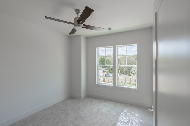 empty room with light carpet and ceiling fan